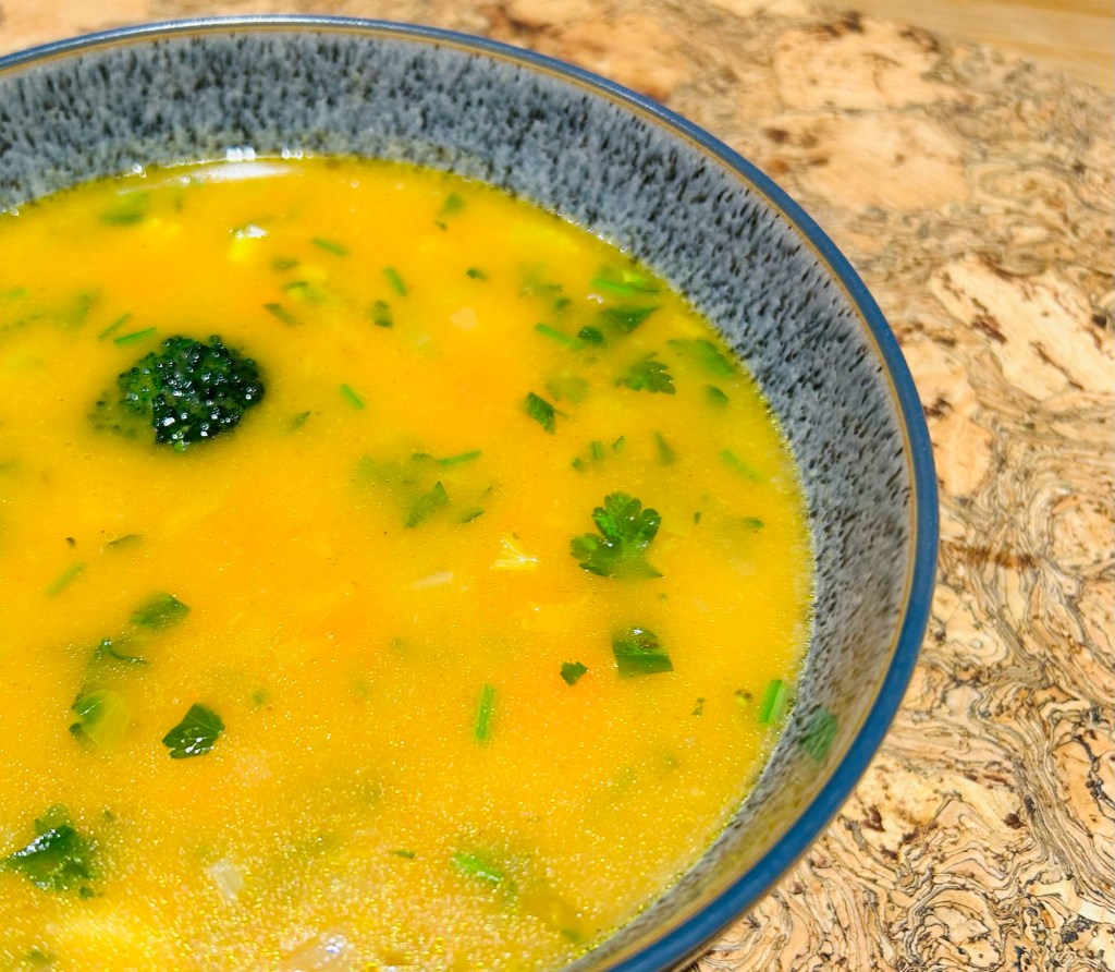 Vegetable soup with Parmesan stock
